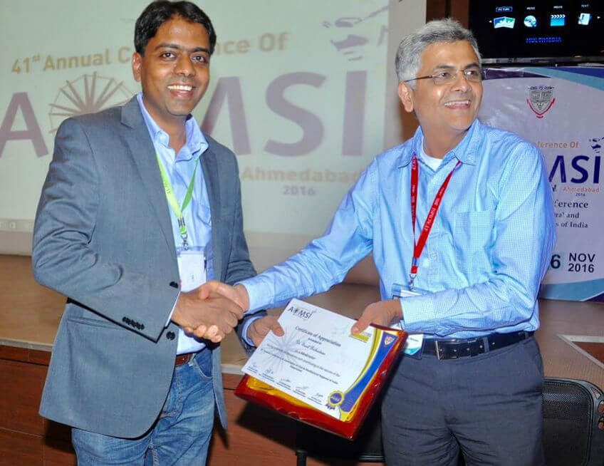 Receiving the certificate and plaque from Dr Krishnamoorthy Editor of Indian maxillofacial journal after moderating the session on cleft maxillary hypoplasia at the national conference in Ahmedabad